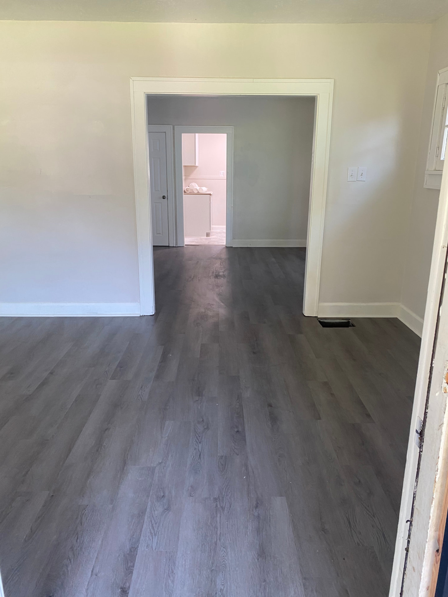 New luxury vinyl plank flooring installation in progress in an Indianapolis home