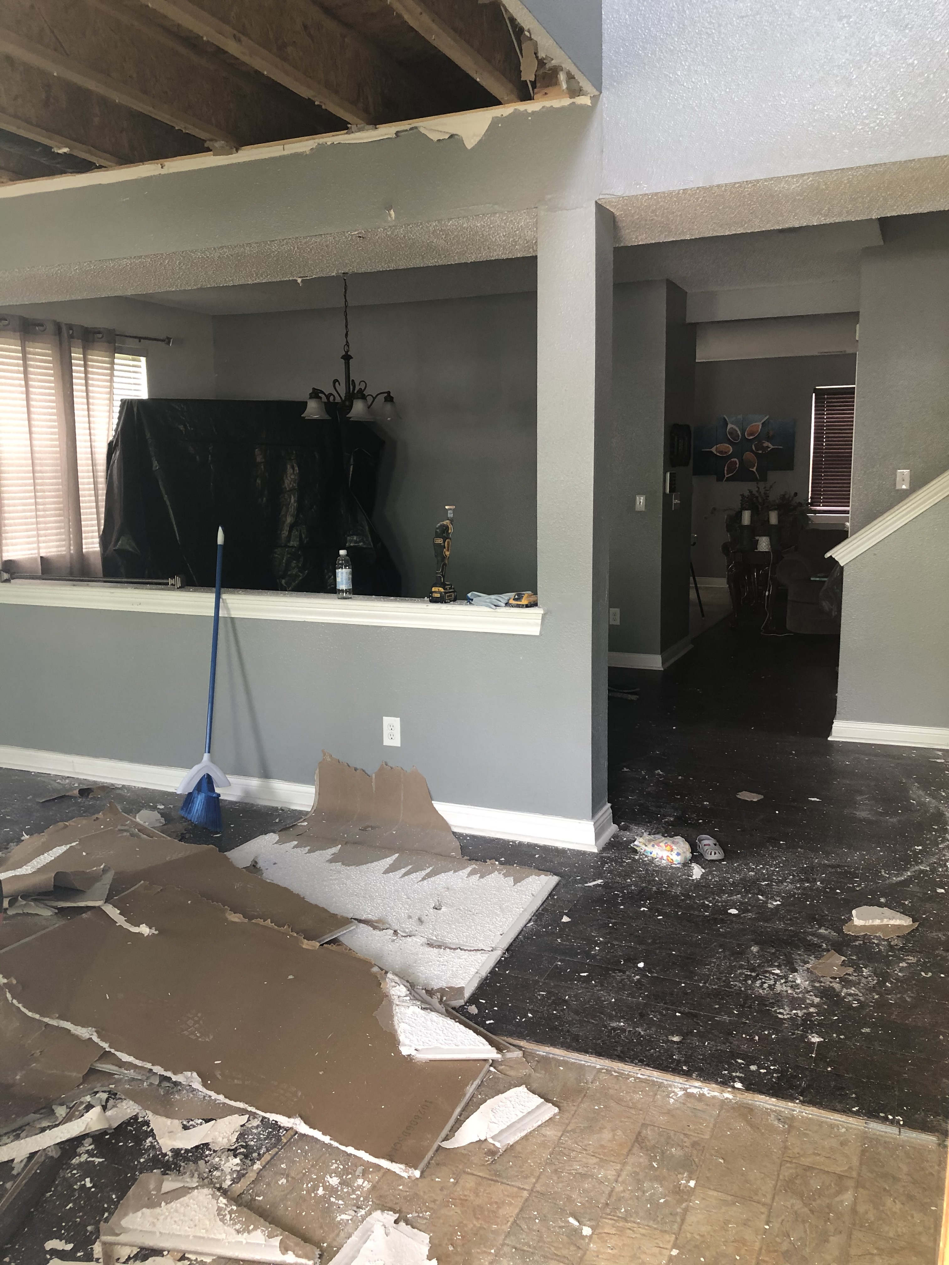 Fire and water damaged Indianapolis interior with ceiling and drywall demolition in progress